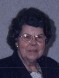 Photo d’une femme plus âgée portant des lunettes.