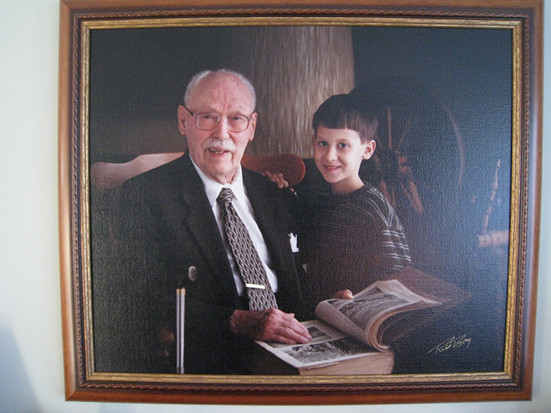 Encadrement peinture de vieux monsieur avec un jeune garçon, en lisant un livre
